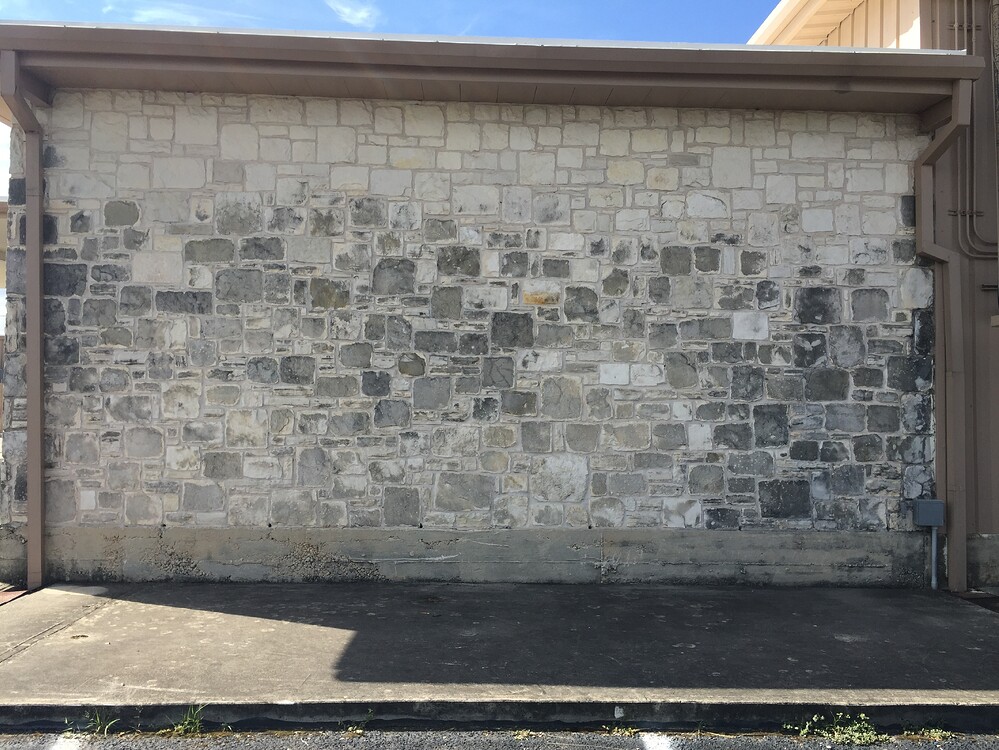 Black stains on limestone columns, pedestals how to clean? Stains