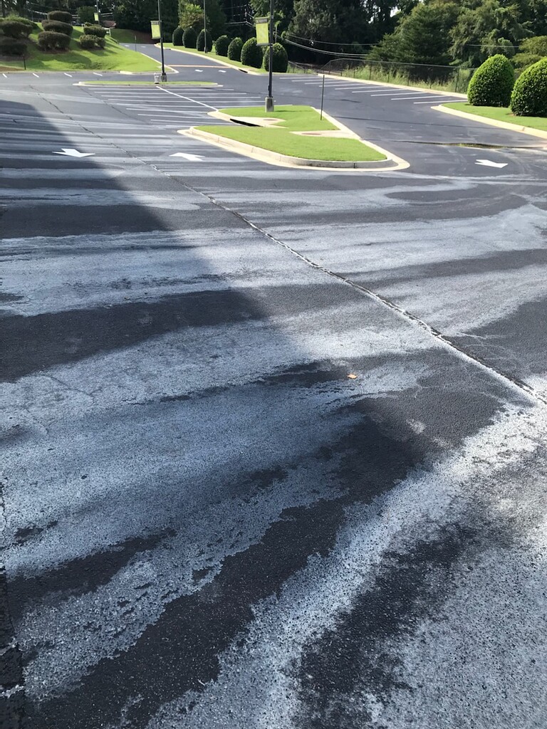 Asphalt stained after pressure washing concrete Stains/Surfaces
