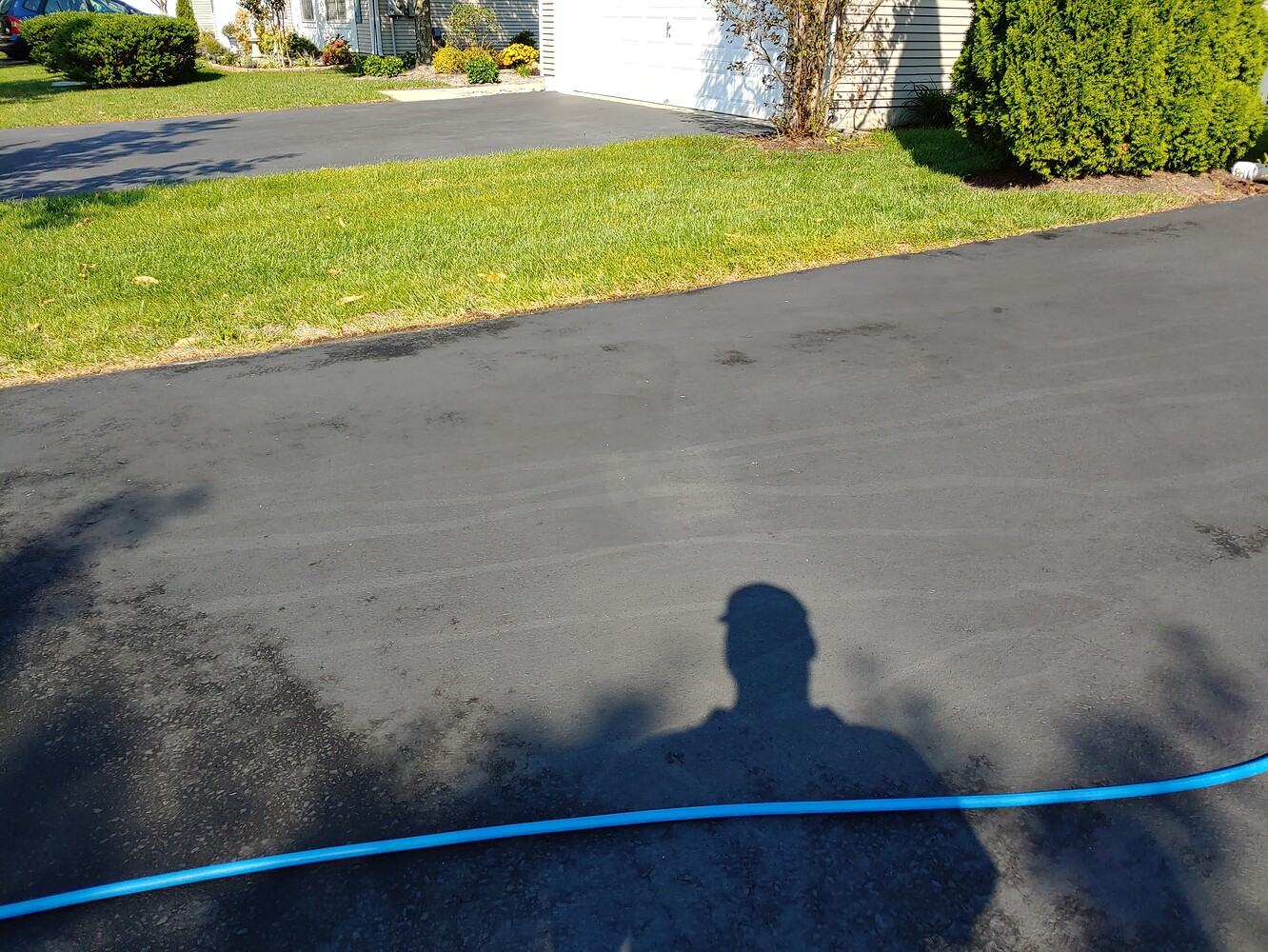 House wash stained asphalt driveway Residential Pressure Washing