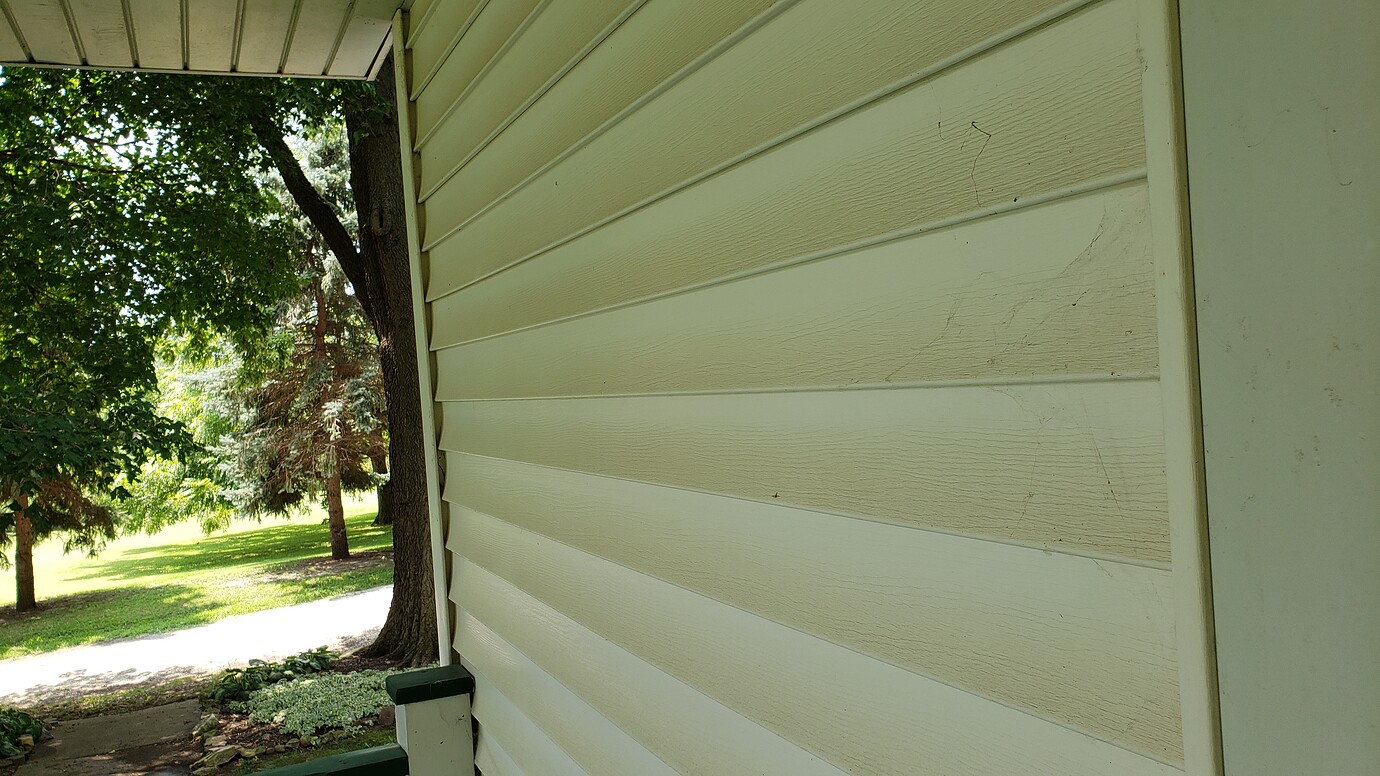 Dirt/Limestone Stained Vinyl Siding Residential Pressure Washing