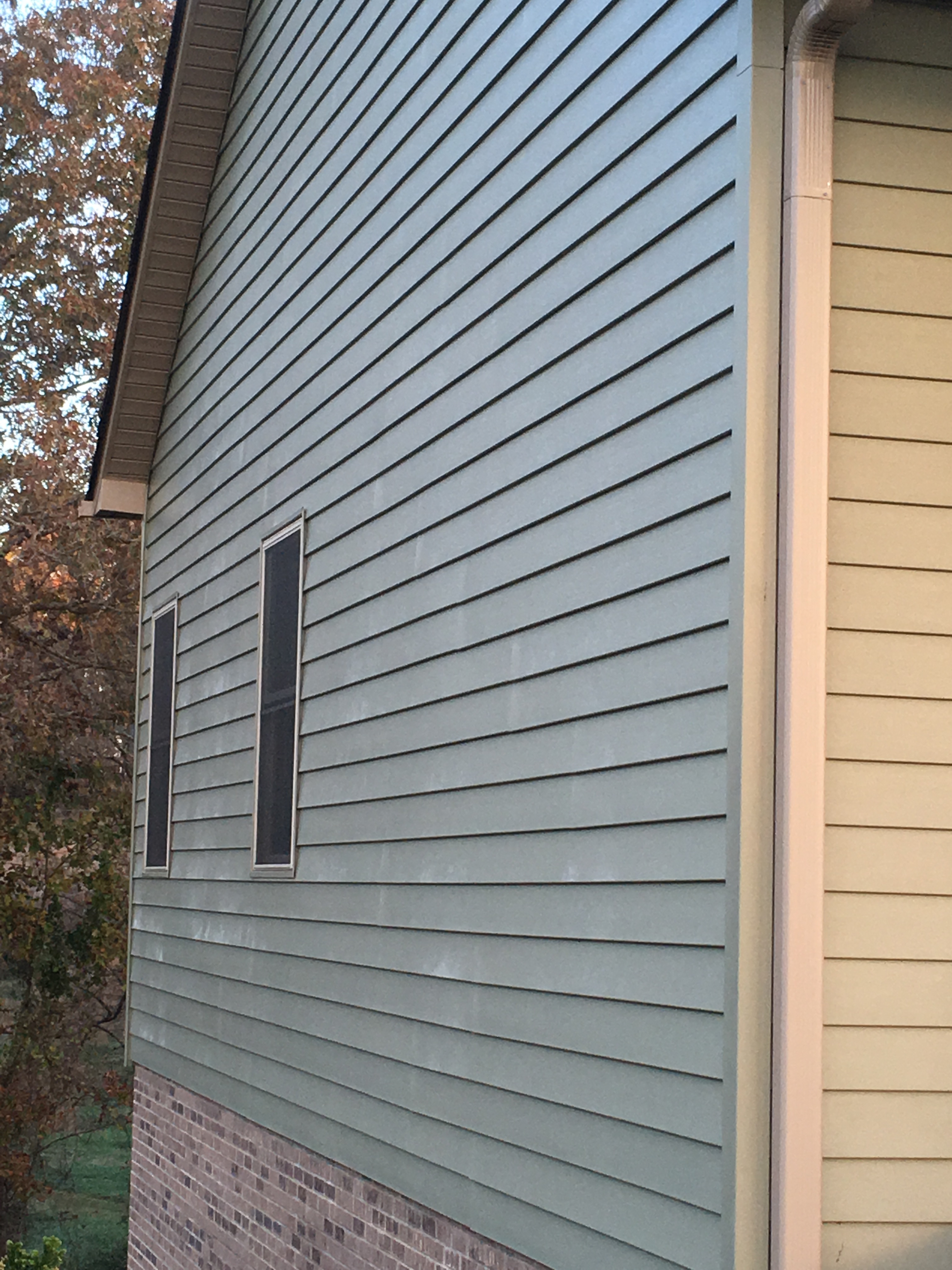 staining vinyl siding